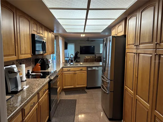 a kitchen with a refrigerator a sink and dishwasher
