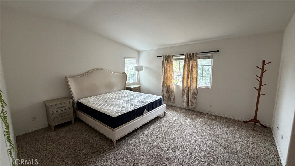 7134 Cumberland Place Rancho Cucamonga, CA 91739 - Photo 11 of 22 a bed sitting in a bedroom next to a window