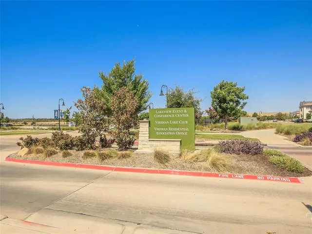 a view of a yard with flower plants