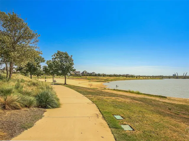 a view of an ocean with trees