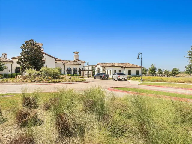 a front view of a building with swimming pool