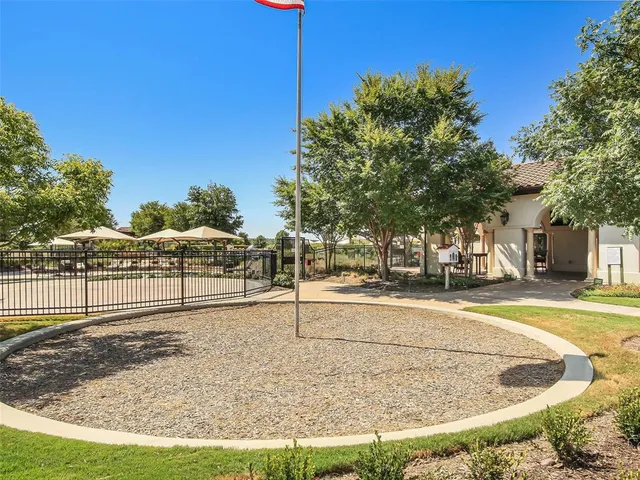 a view of a swimming pool with a lawn chairs