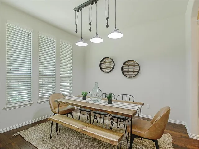 a view of a dining room that has a table and chair
