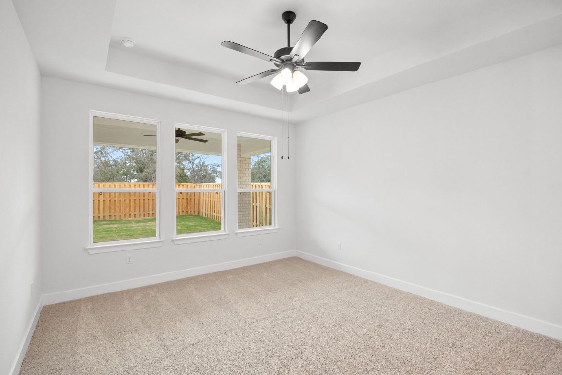 617 Buckaroo Drive Georgetown, TX 78633 - Photo 12 of 33 an empty room with a window and a ceiling fan