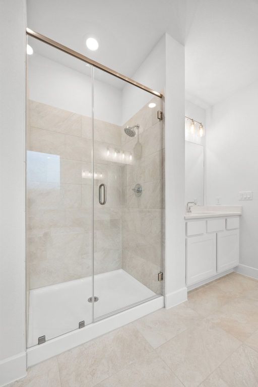 617 Buckaroo Drive Georgetown, TX 78633 - Photo 14 of 33 a bathroom with a shower and a glass door