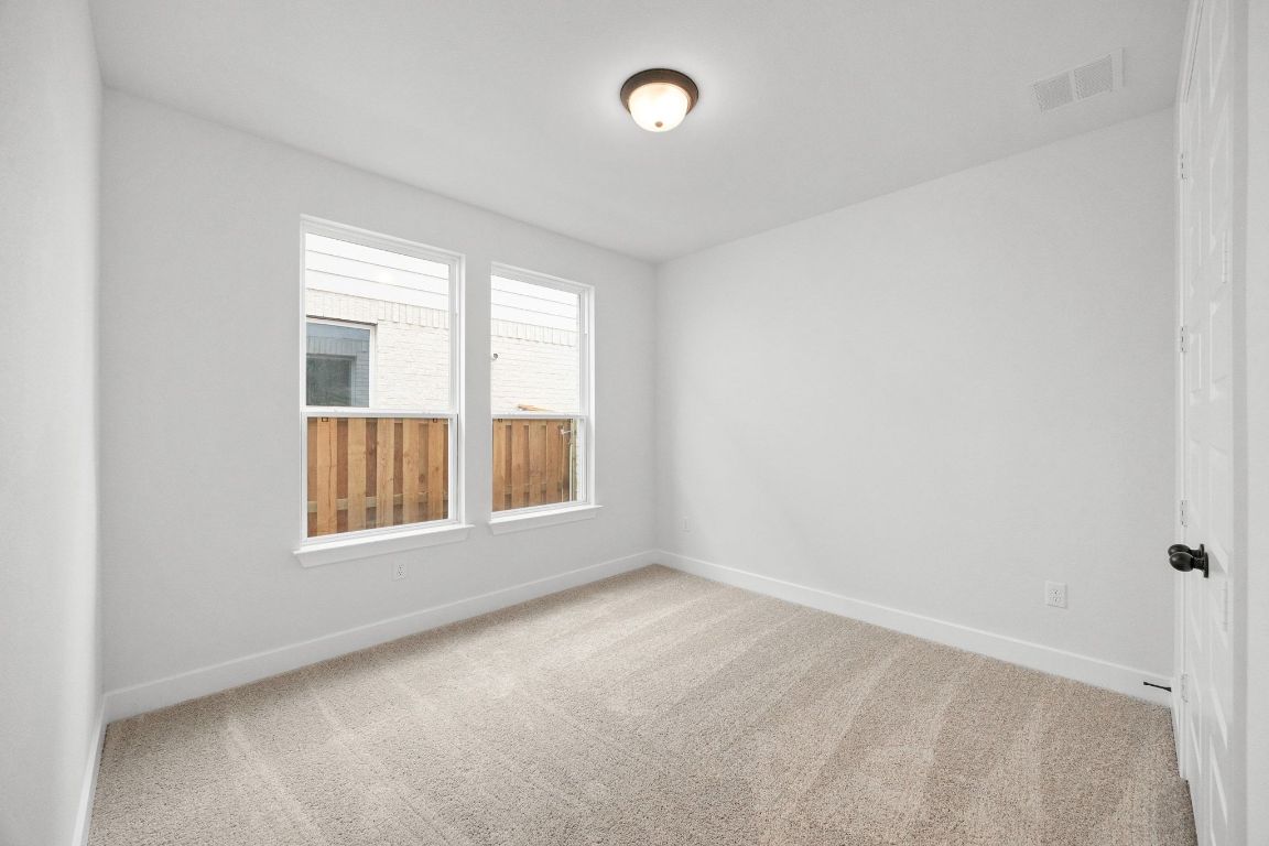 617 Buckaroo Drive Georgetown, TX 78633 - Photo 16 of 33 an empty room with windows