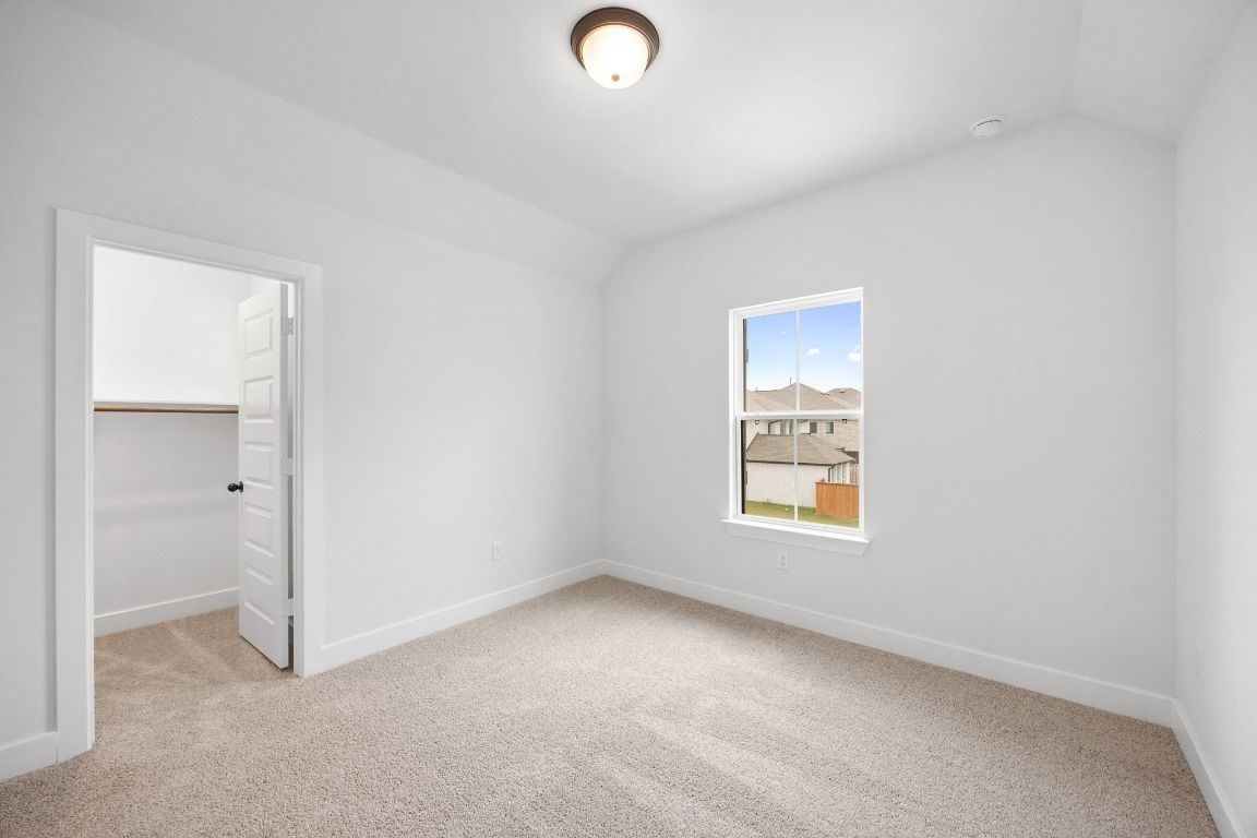 617 Buckaroo Drive Georgetown, TX 78633 - Photo 24 of 33 a view of an empty room with a window and closet