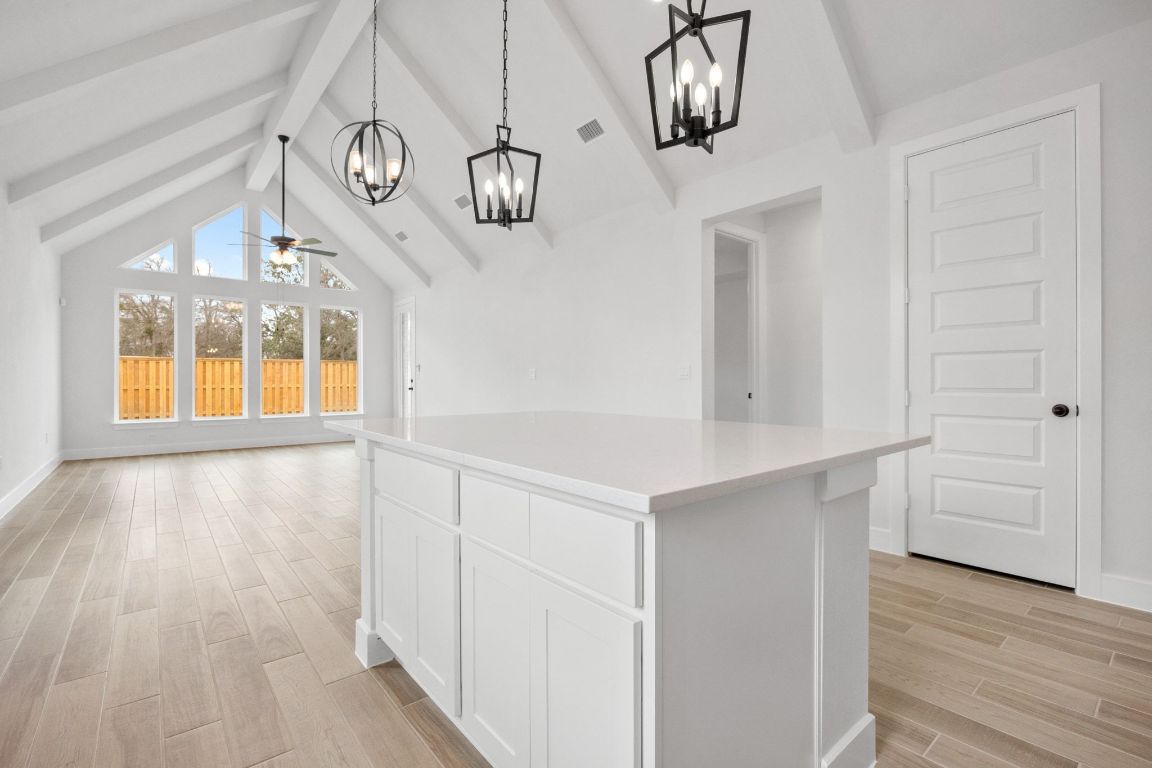 617 Buckaroo Drive Georgetown, TX 78633 - Photo 7 of 33 wooden floor in an empty room with a window