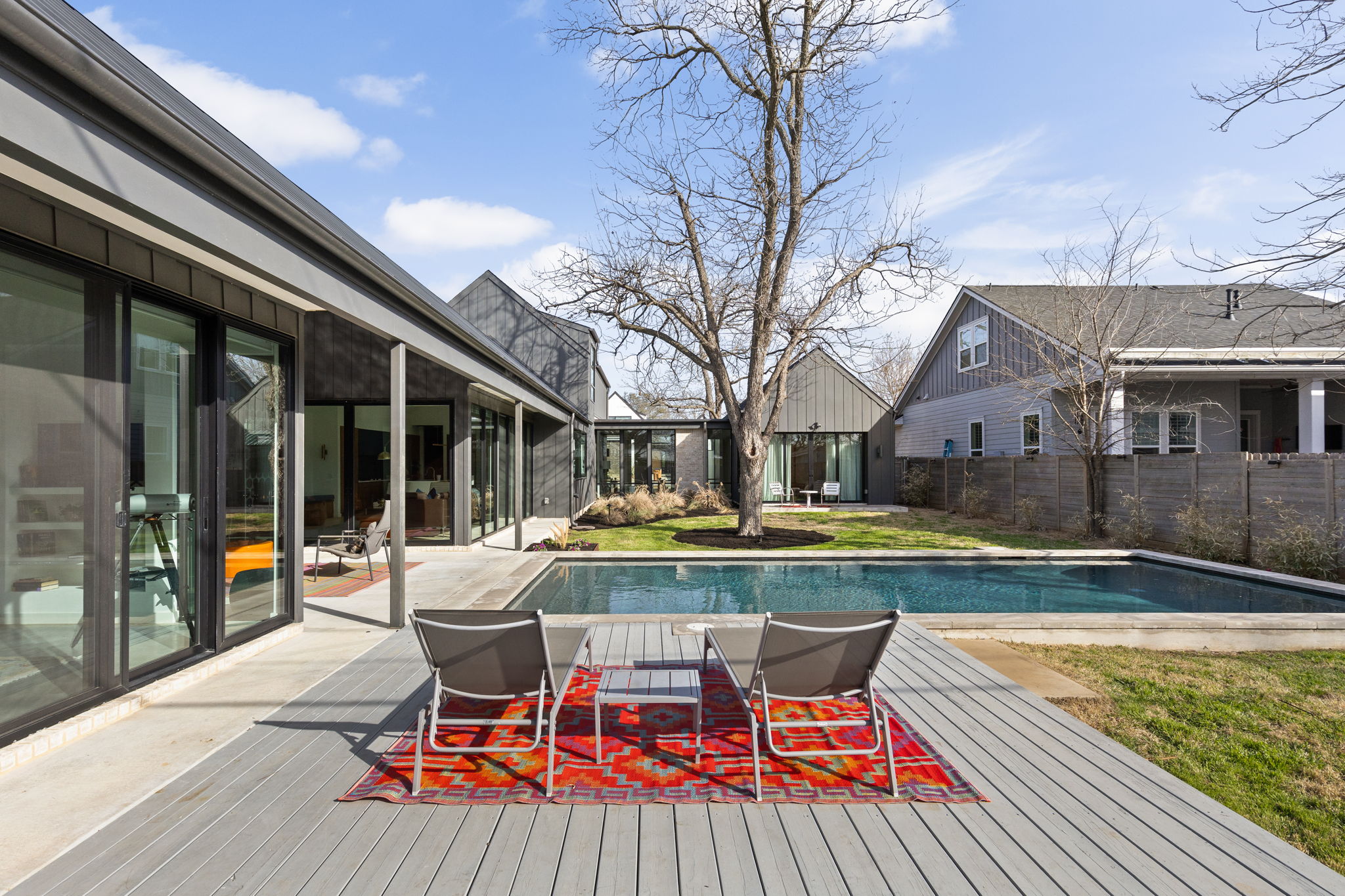 7502 St Louis Street Austin, TX 78757 - Photo 28 of 38 View of pool featuring patio surround and a wooden deck