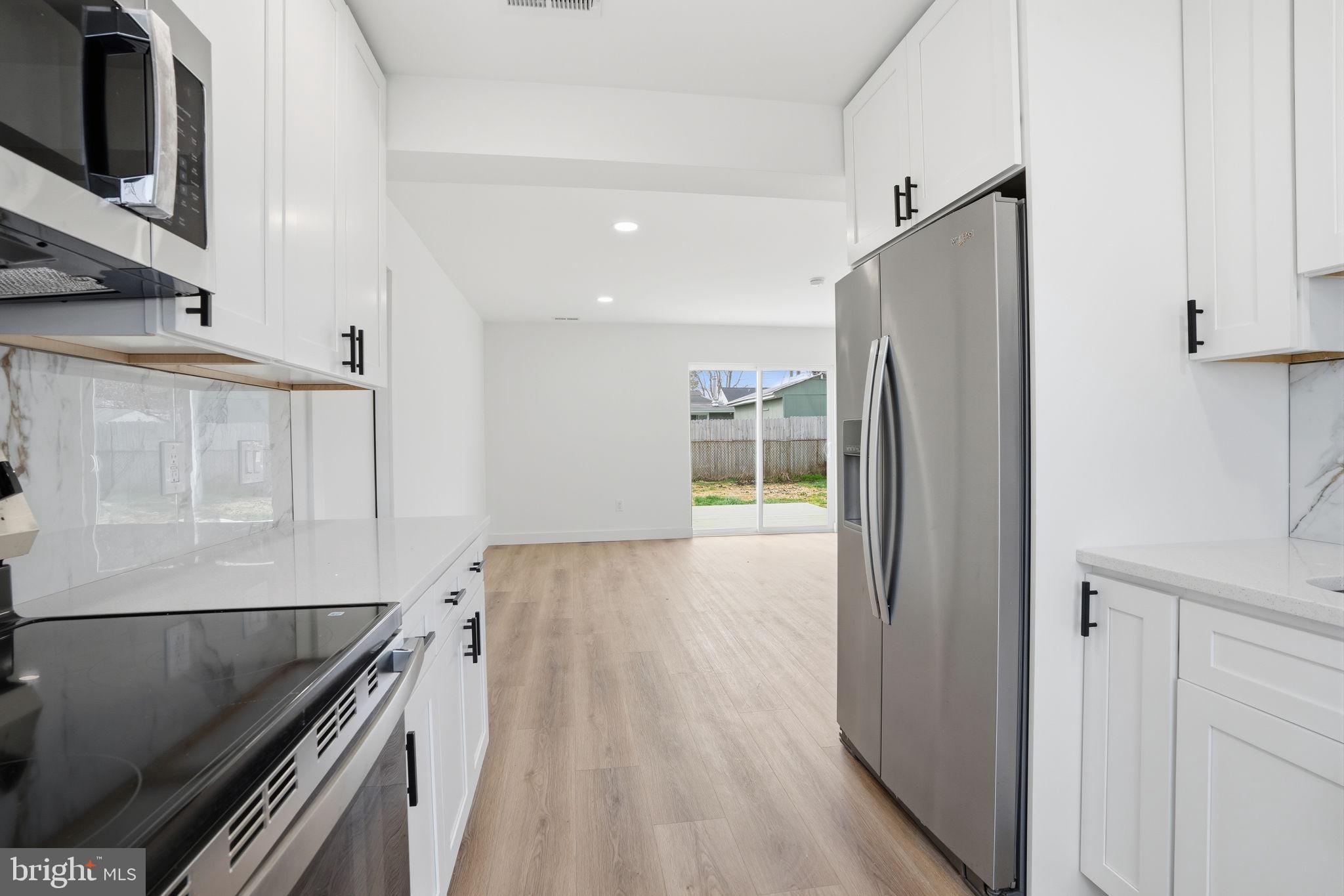 14 Inlet Road Levittown, PA 19057 - Photo 10 of 31 a view of a kitchen from the hallway
