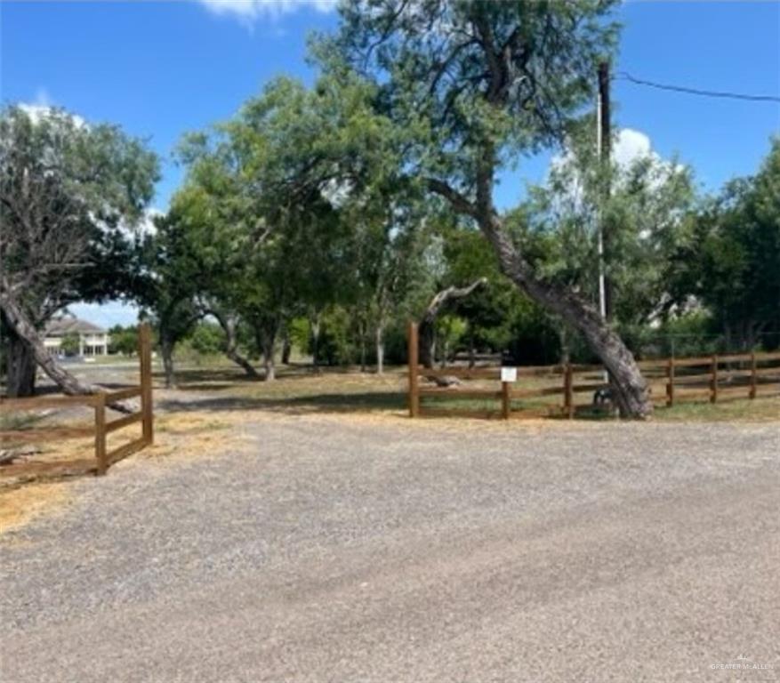 a view of a yard with swimming pool