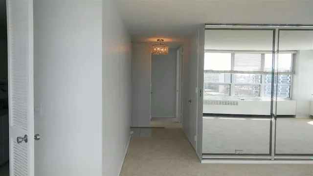 a view of a glass door and a living room