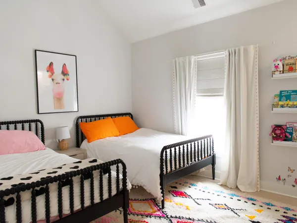 a bathroom with a granite countertop sink a toilet and a mirror