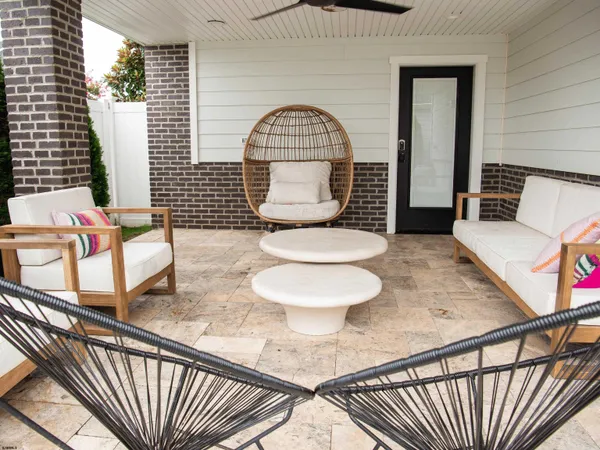 a view of a chairs and tables in the patio