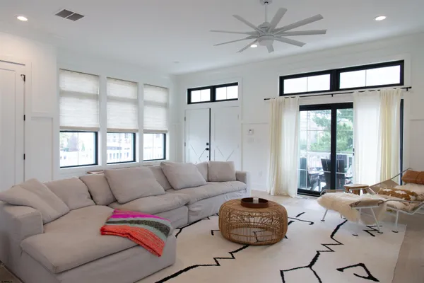 a living room with furniture fireplace and flat screen tv