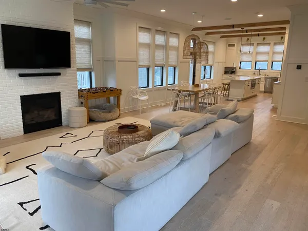 a dinning area with furniture and a large window