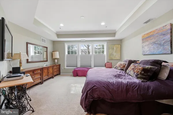 a bed room with a bed and a couch
