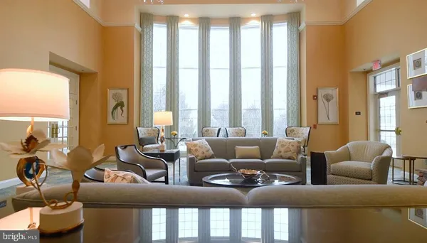 a room with pool table and a large window
