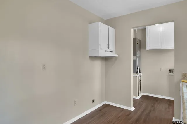 a view of cabinets and wooden floor