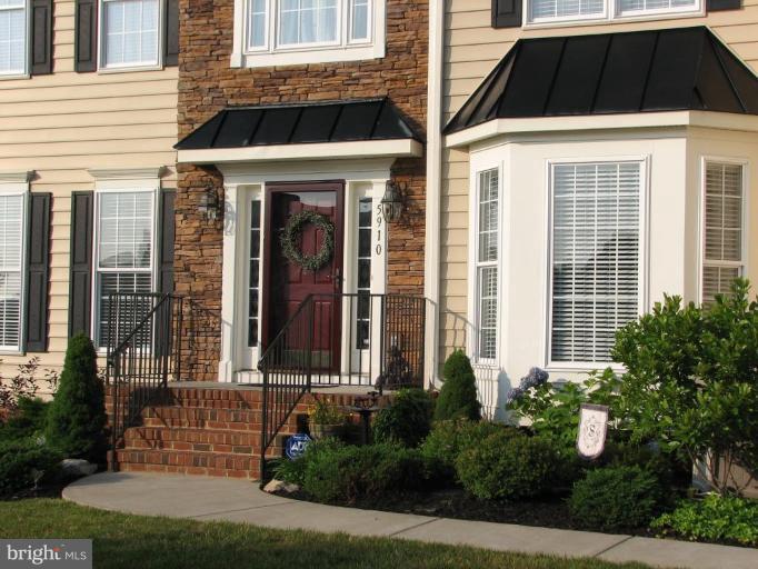 5910 Sunlight Mountain Road Spotsylvania, VA 22553 - Photo 2 of 30 front view of a brick house with a yard
