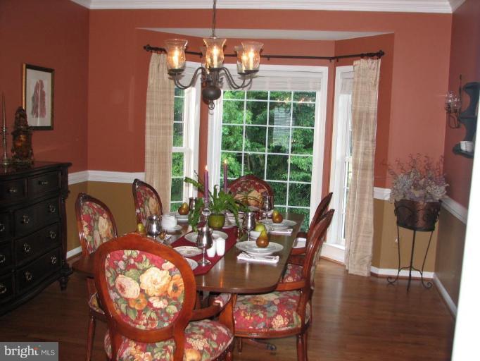5910 Sunlight Mountain Road Spotsylvania, VA 22553 - Photo 11 of 30 a view of a dining room with furniture window and wooden floor