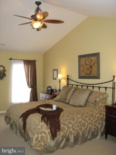 5910 Sunlight Mountain Road Spotsylvania, VA 22553 - Photo 22 of 30 a living room with furniture and a chandelier