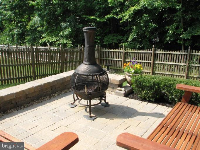 5910 Sunlight Mountain Road Spotsylvania, VA 22553 - Photo 6 of 30 a view of balcony with wooden floor outdoor seating and trees