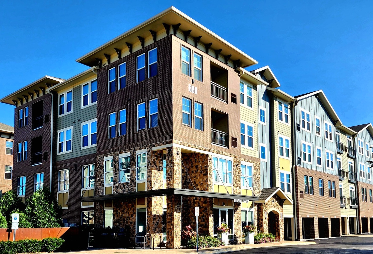 a front view of a building with a lot of windows