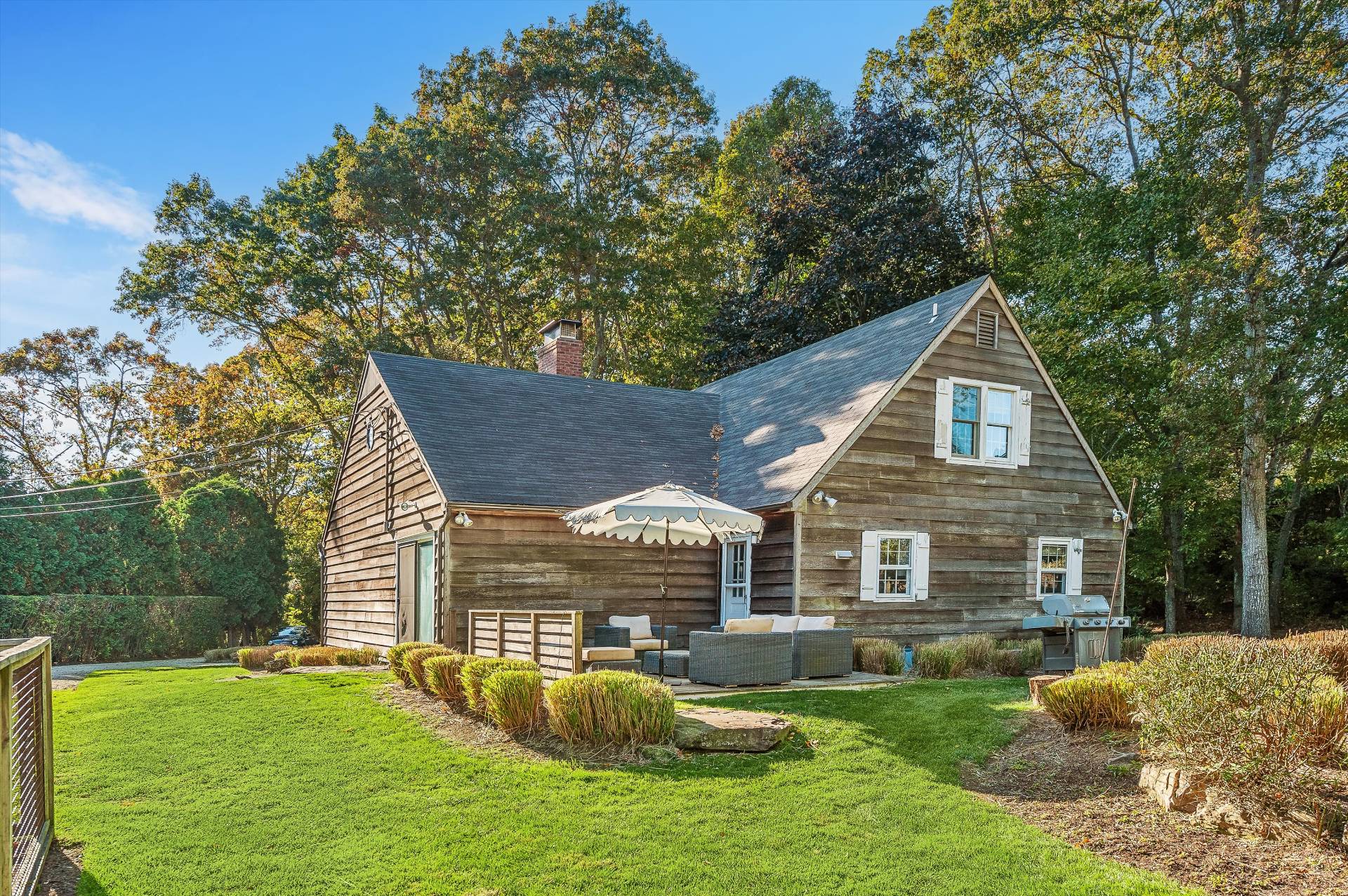 356 7 Ponds Towd Road Water Mill, NY 11976 - Photo 5 of 22 a front view of house with yard and green space