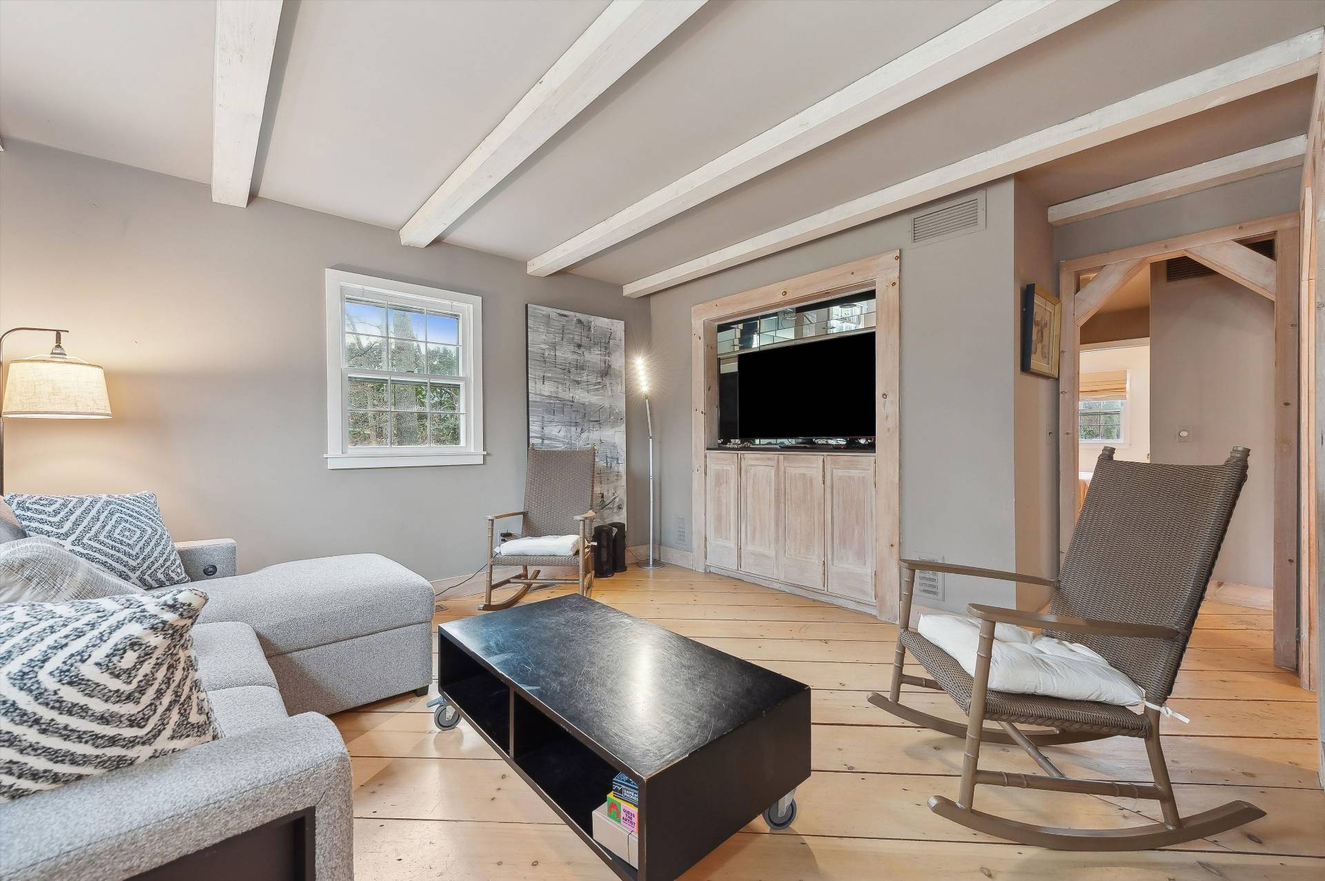 356 7 Ponds Towd Road Water Mill, NY 11976 - Photo 10 of 22 a living room with a flat screen tv and a fireplace