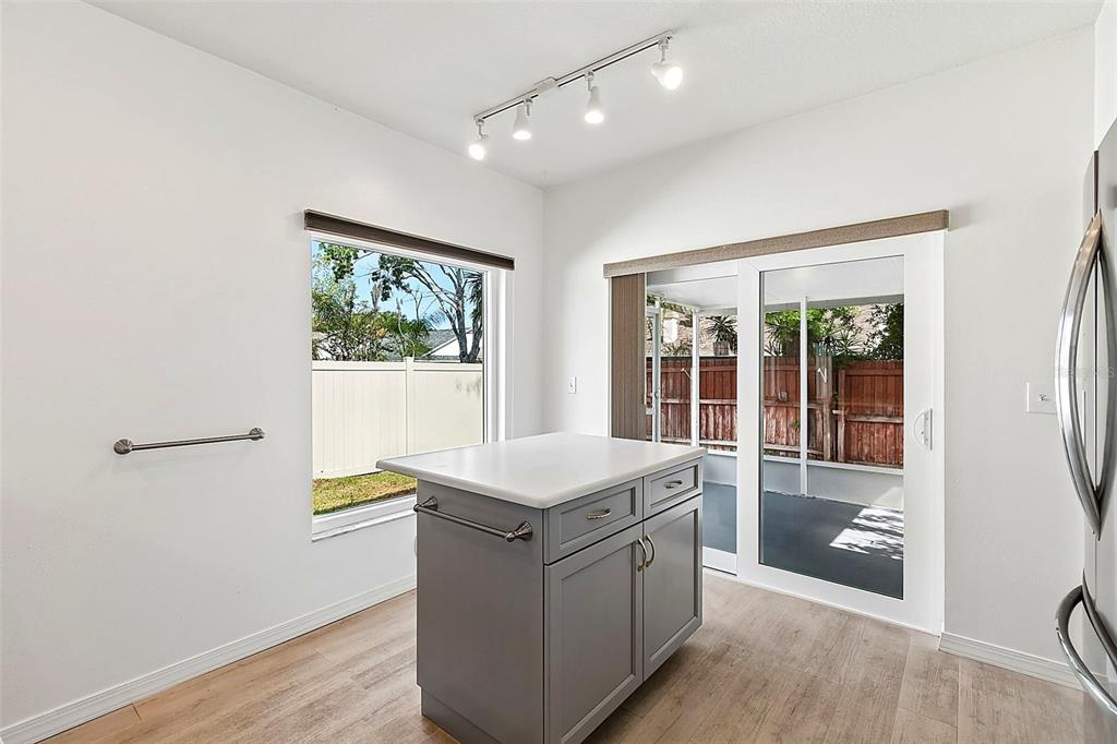 5311 Watson Road Riverview, FL 33578 - Photo 13 of 33 a room with a wooden floor and white walls