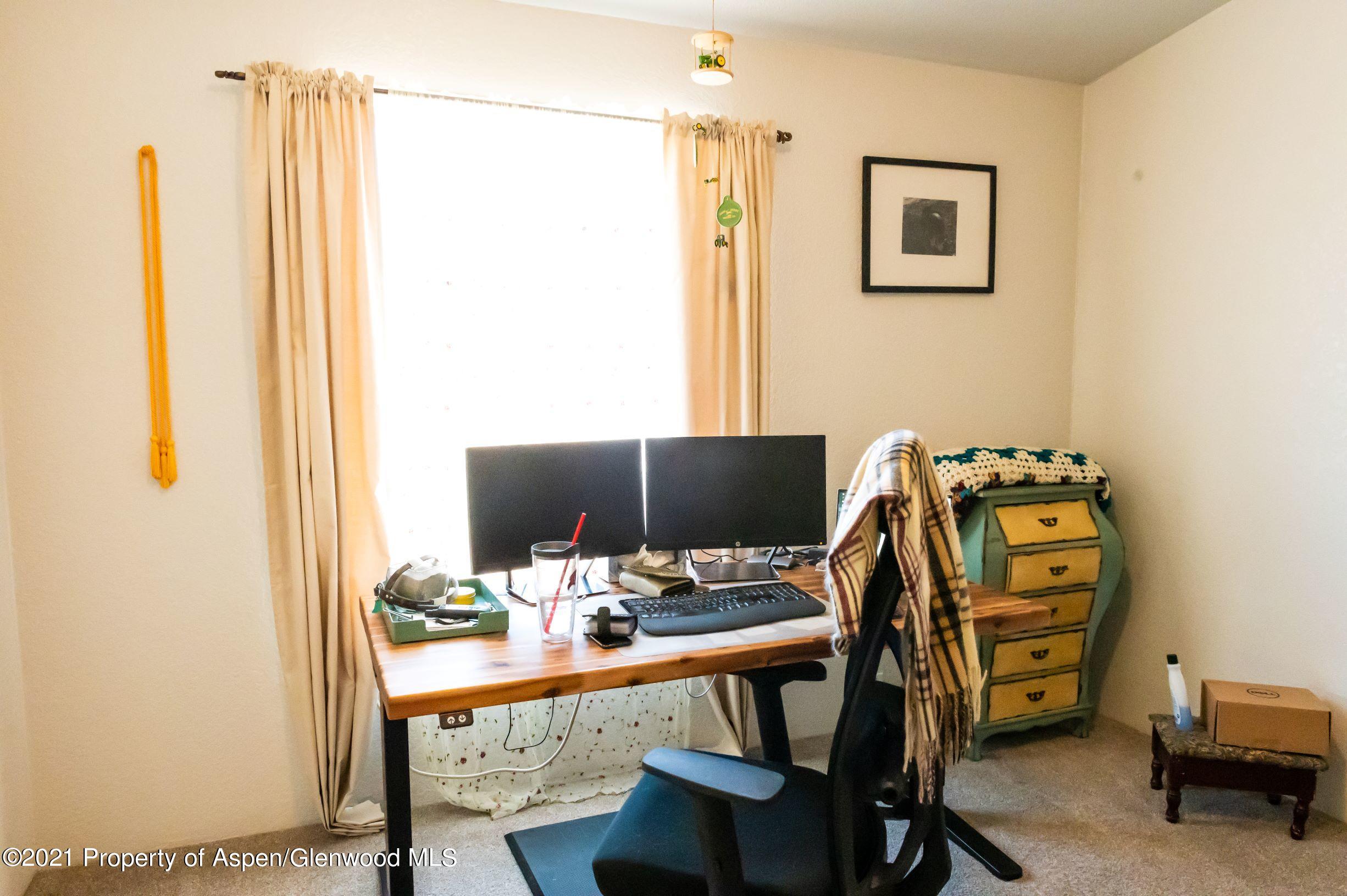 3171 County Road 233 Rifle, CO 81650 - Photo 16 of 36 a view of a workspace with furniture