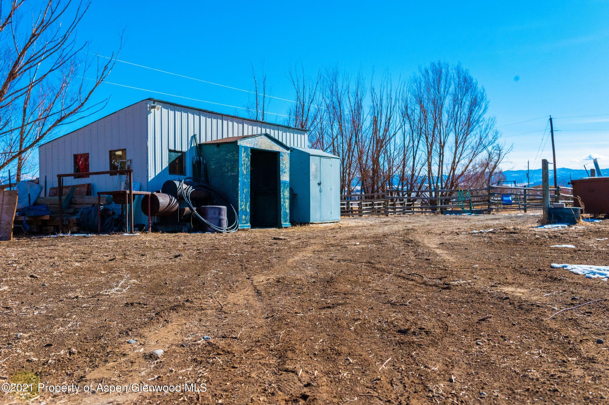 3171 County Road 233 Rifle, CO 81650 - Photo 19 of 36 a view of a house with a yard