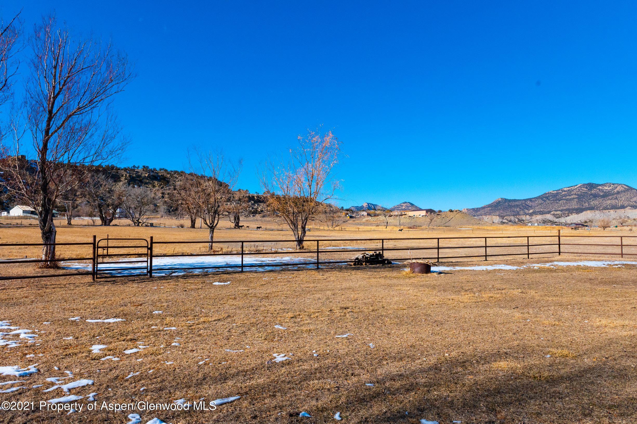 3171 County Road 233 Rifle, CO 81650 - Photo 26 of 36 a view of a yard with wooden fence