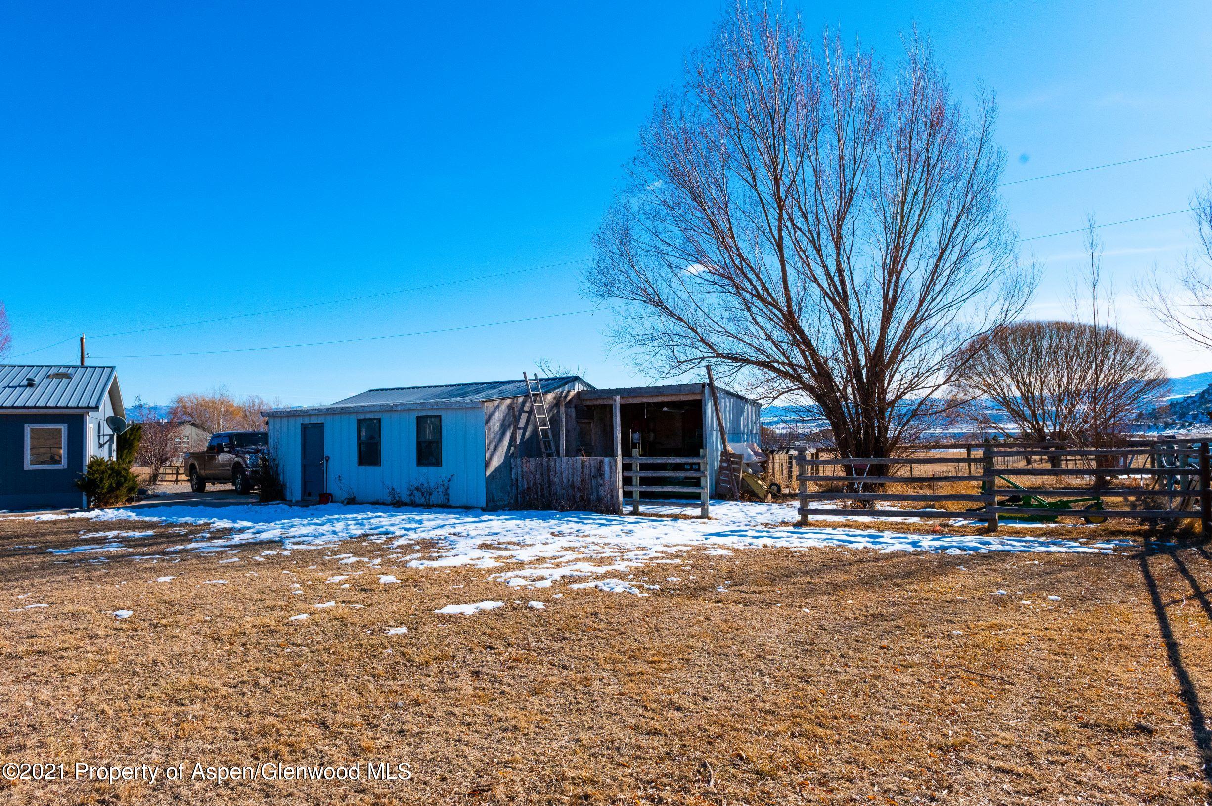 3171 County Road 233 Rifle, CO 81650 - Photo 27 of 36 a view of a yard with a house