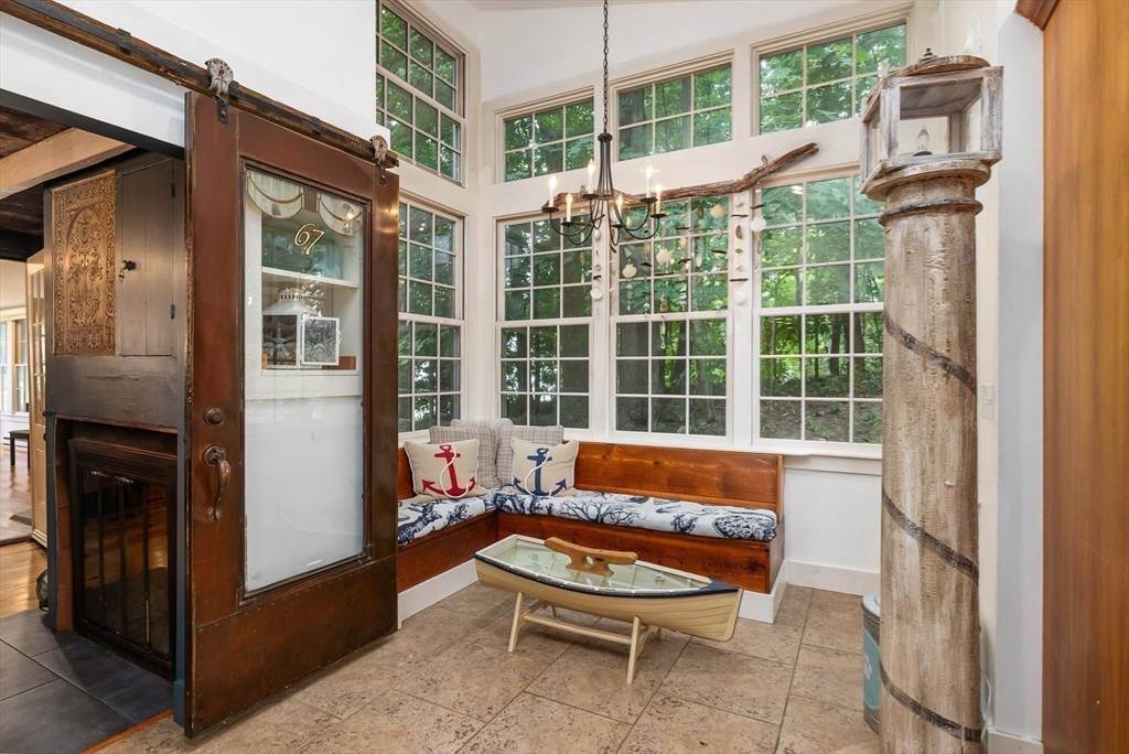 356 Main Street Amesbury, MA 01913 - Photo 17 of 41 a blue bench sitting in front of a building