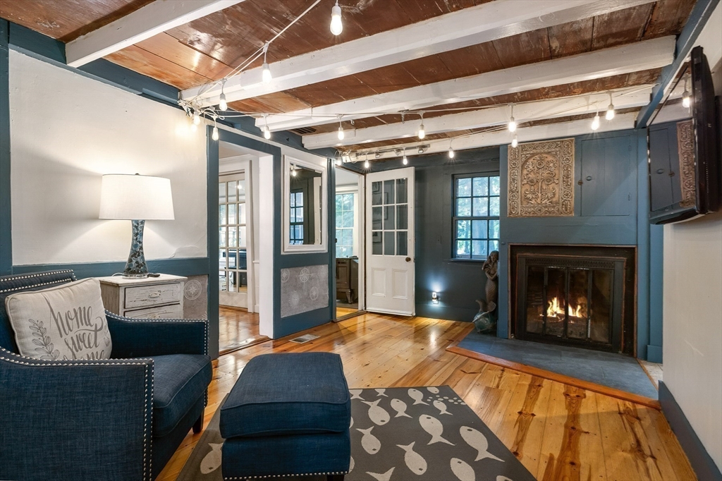 356 Main Street Amesbury, MA 01913 - Photo 18 of 41 a living room with furniture and a fireplace