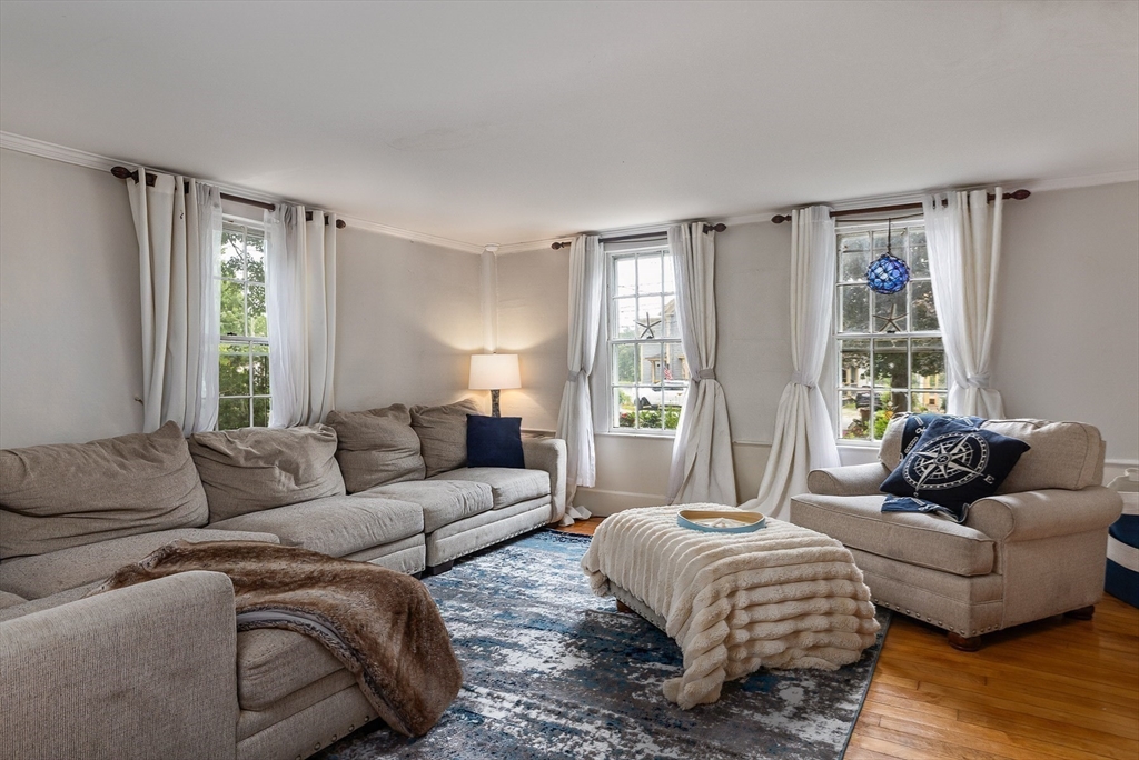 356 Main Street Amesbury, MA 01913 - Photo 24 of 41 a living room with furniture and a large window