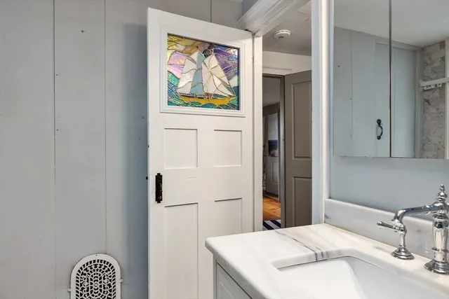 a bathroom with a sink and a mirror