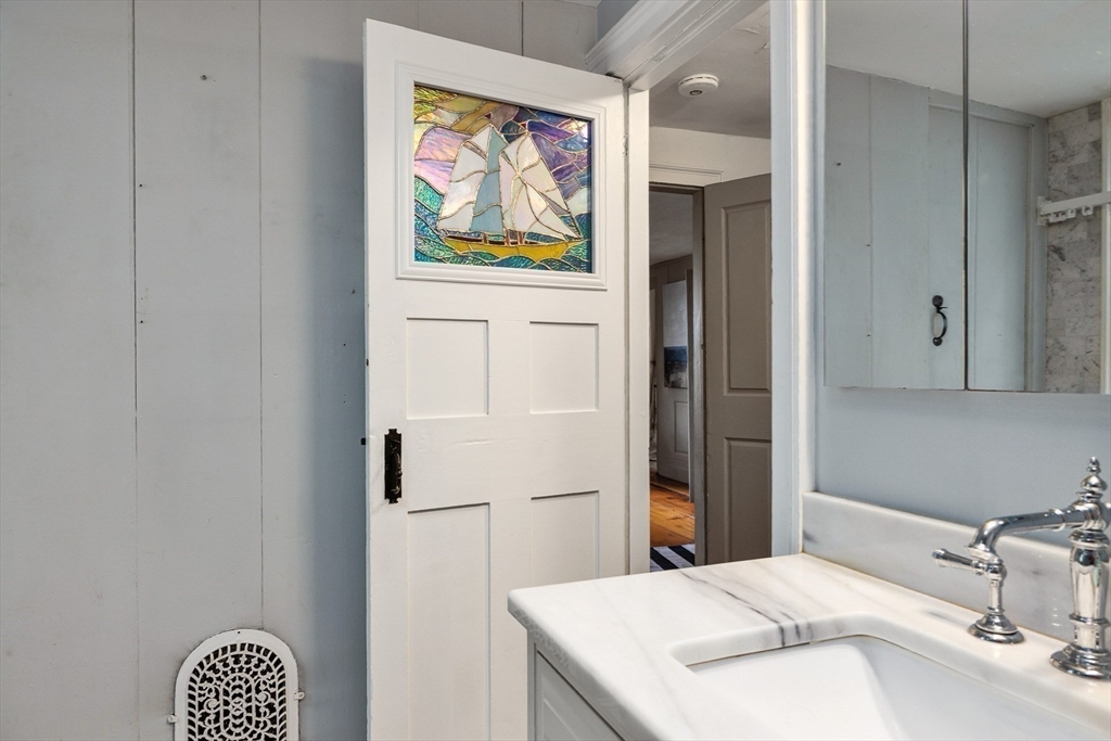 356 Main Street Amesbury, MA 01913 - Photo 29 of 41 a bathroom with a sink and a mirror