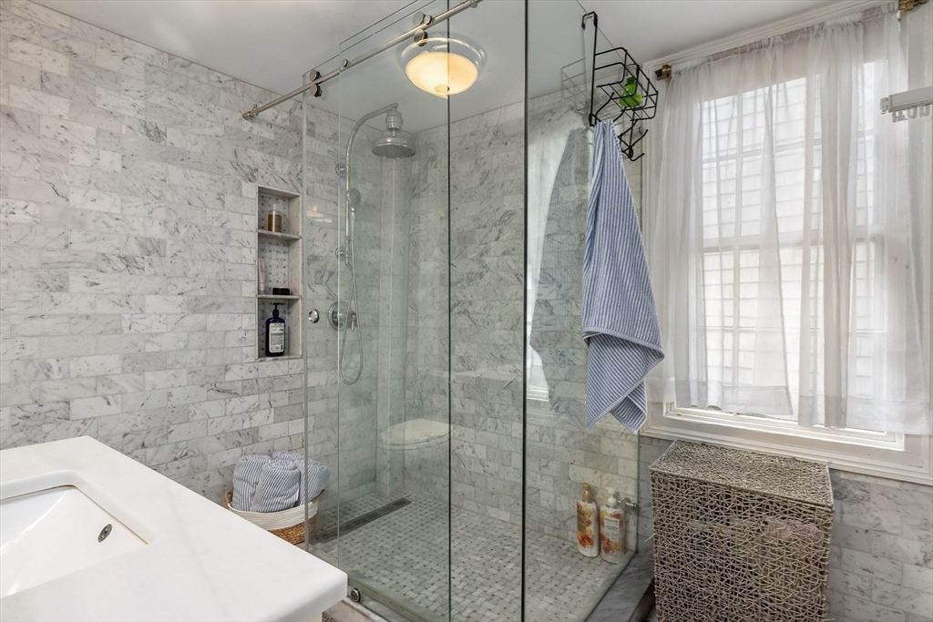 356 Main Street Amesbury, MA 01913 - Photo 30 of 41 a bathroom with a sink a toilet and shower