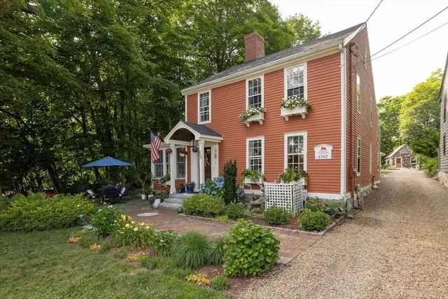 a front view of a house with garden
