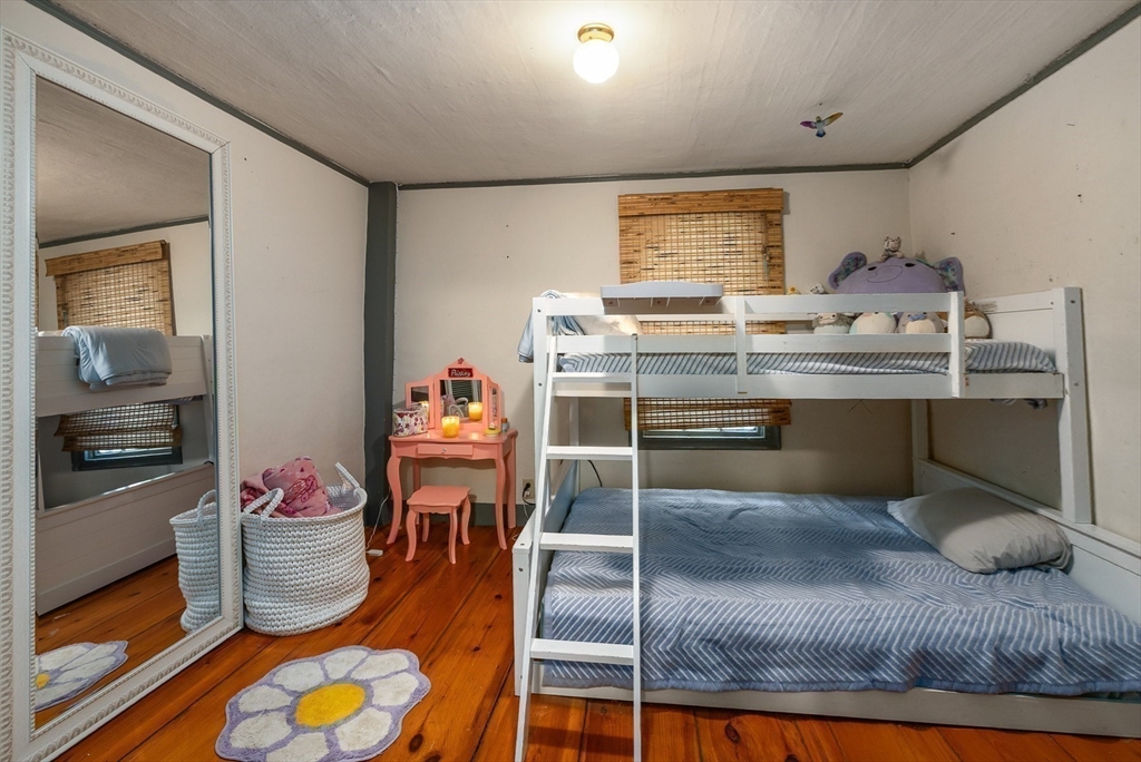 356 Main Street Amesbury, MA 01913 - Photo 32 of 41 a room with wooden floor and furniture