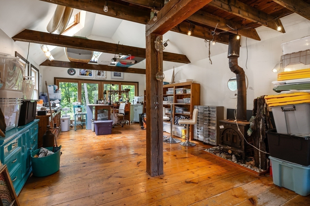 356 Main Street Amesbury, MA 01913 - Photo 36 of 41 a view of living room with wooden floor and furniture