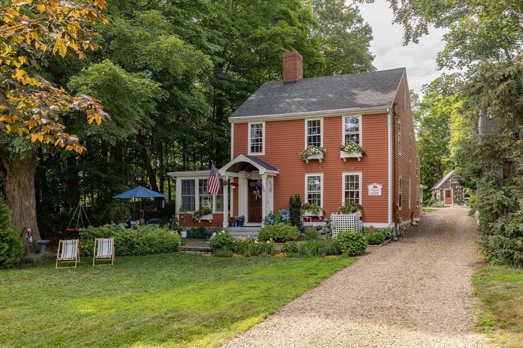 356 Main Street Amesbury, MA 01913 - Photo 41 of 41 a front view of a house with a yard garden and patio