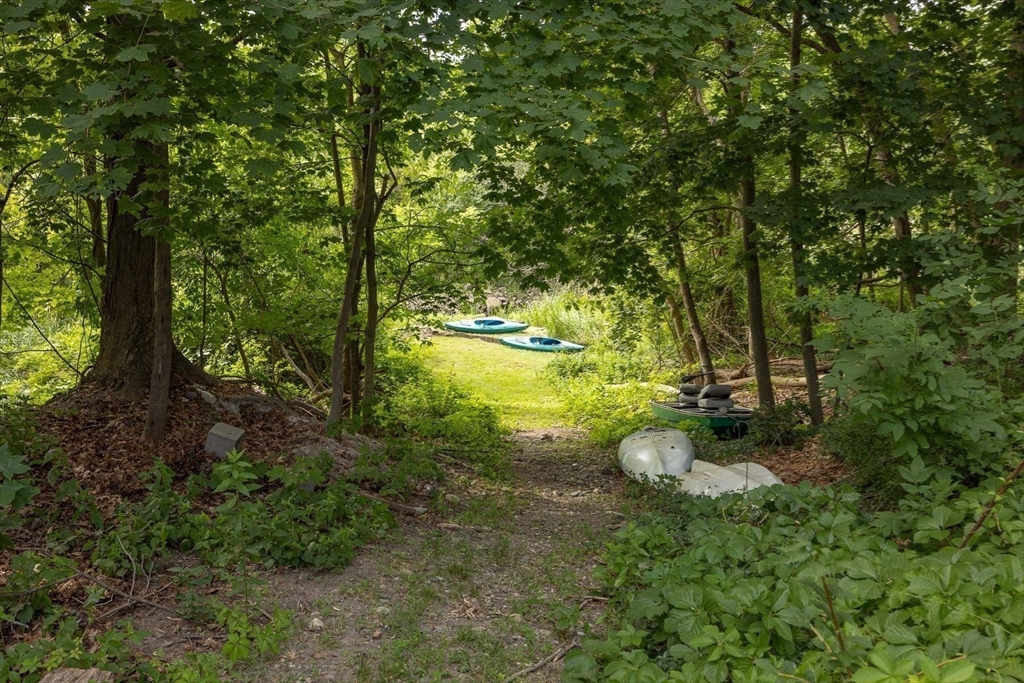 356 Main Street Amesbury, MA 01913 - Photo 6 of 41 a backyard of a house with yard and outdoor seating