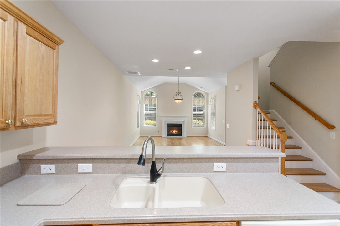 155 Life Style Lane Anderson, SC 29621 - Photo 15 of 49 This bright and airy interior boasts a captivating fireplace, high ceilings, and beautiful hardwood flooring.