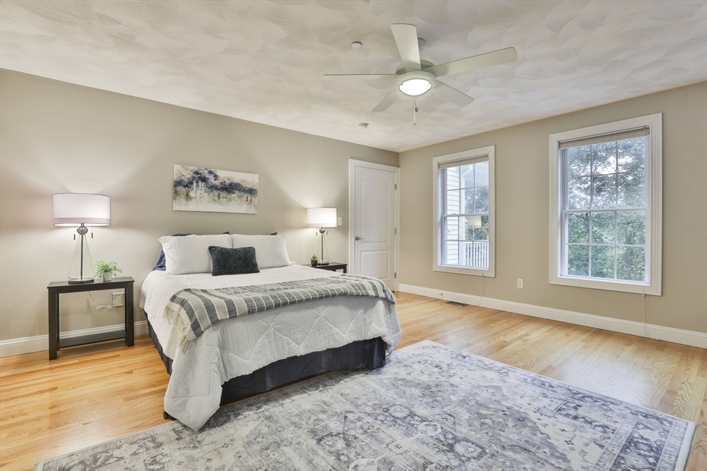 53 Cooper Street Wakefield, MA 01880 - Photo 16 of 42 a spacious bedroom with a large bed and a window