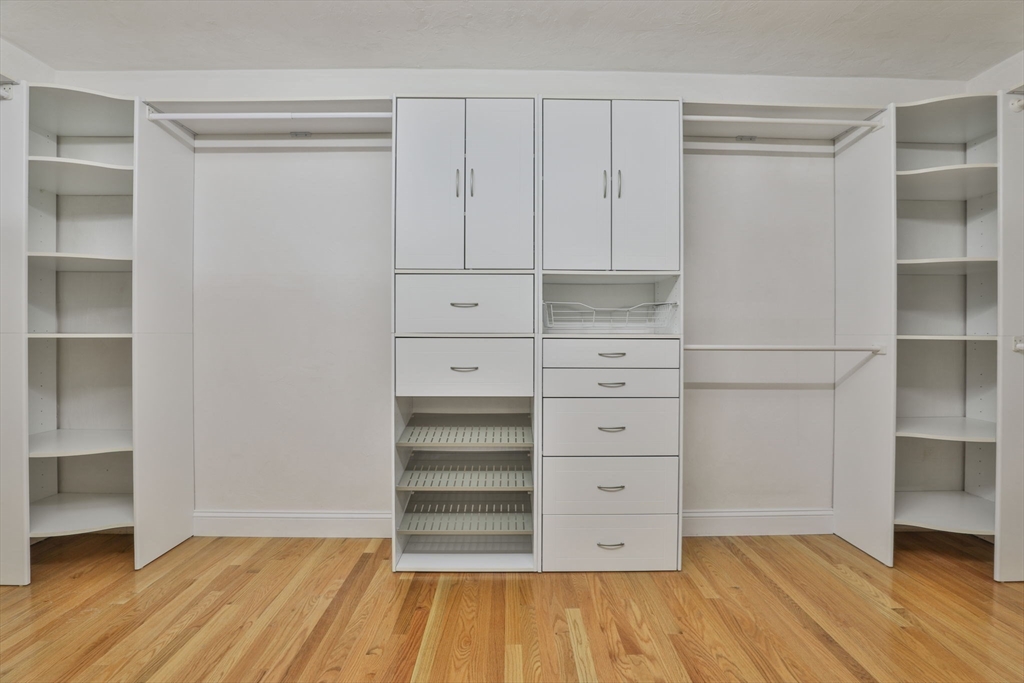 53 Cooper Street Wakefield, MA 01880 - Photo 18 of 42 a view of walk in closet with empty racks