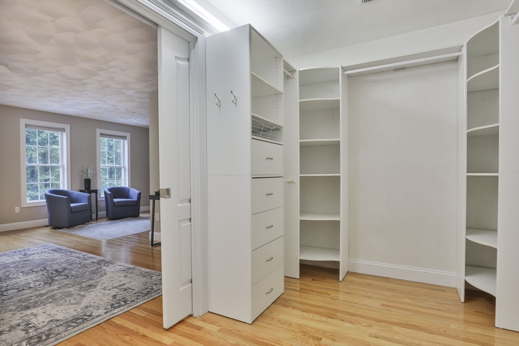 53 Cooper Street Wakefield, MA 01880 - Photo 19 of 42 a view of a livingroom with wooden floor and cabinet